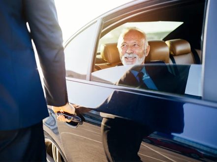 A person being let out of a car