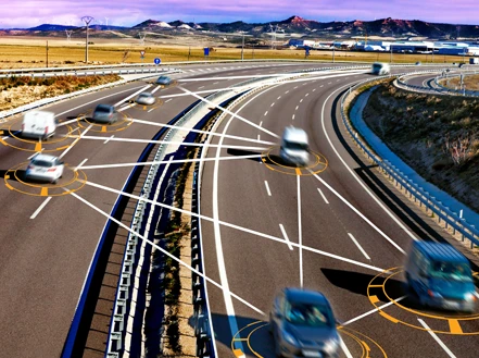 A close-up of a road with cars driving